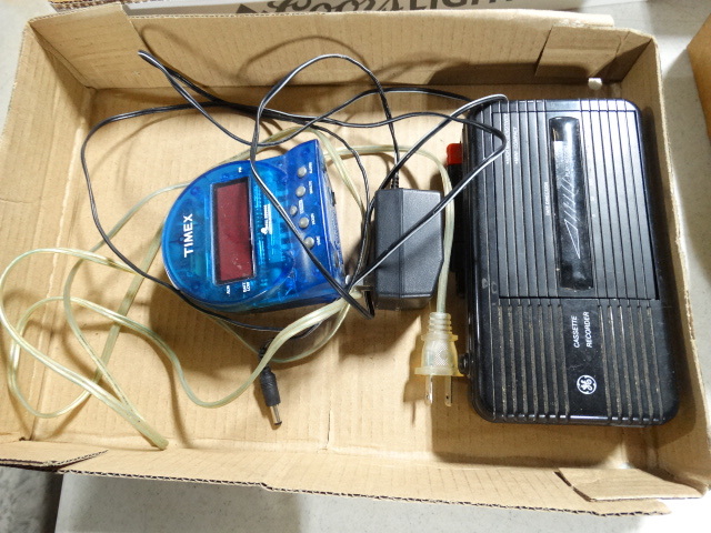 lot 6605 image: Timex clock and cassette recorder.