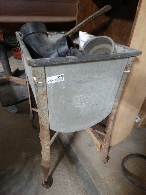 lot 6618 image: Metal wash tub with plumbing pvc parts.