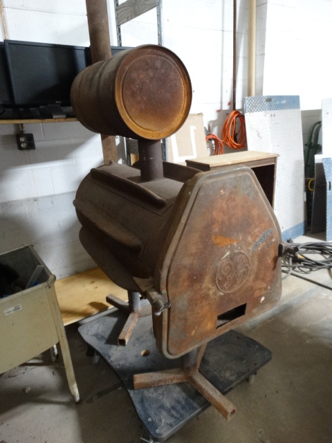 lot 6620 image: Large wood burning stove.