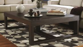 lot 1421 image: Ashley Furniture Watson Dark Brown Rectangular Cocktail Table MSRP $312.99