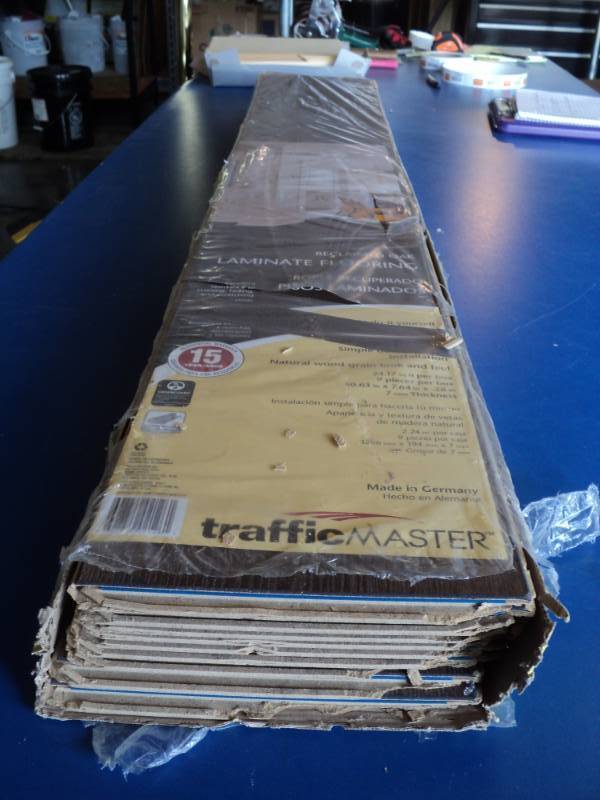 lot 7201 image: Traffic Master reclaimed Oak Laminate flooring 24.17 square foot per box (9) planks 50.63 x 7.64 x .28