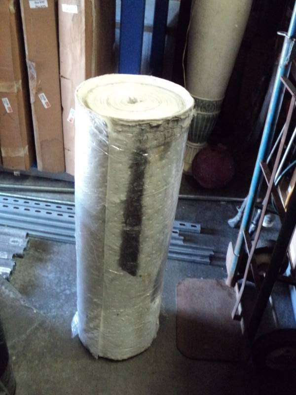 lot 8770 image: (1) roll Oil absorbant pad, 30 x approx 25, outer layer is dirty and damaged