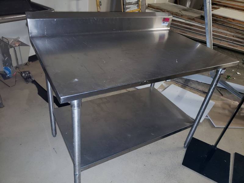 lot 8590 image: All stainless steel 48  x 30  table