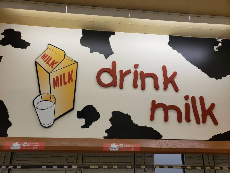 lot 8687 image: Drink milk sign and milk box