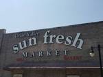 sun fresh market signage on building sun fresh market signage on building
