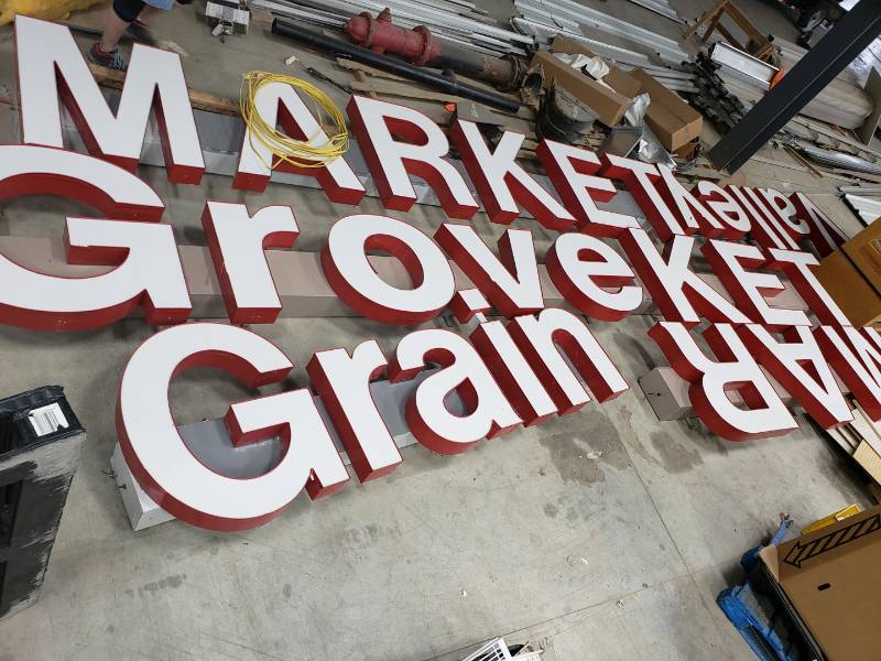lot 8853 image: Oak Grove Grain Valley Market signs