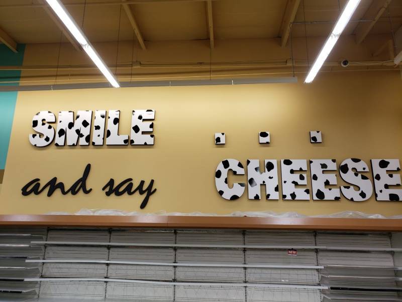 lot 2232 image: Smile and say cheese sign