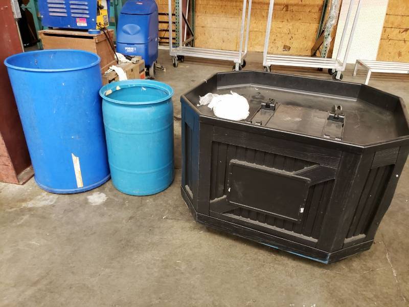 lot 2327 image: Display table and 2 blue trash bins