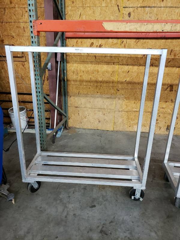 lot 2328 image: Win Holt aluminum rolling rack