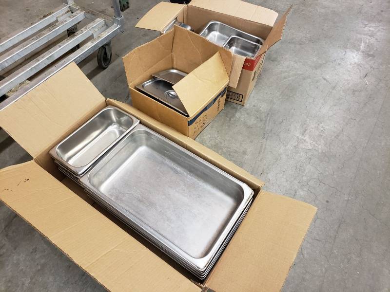 lot 2344 image: 3 boxes of stainless pans and lids