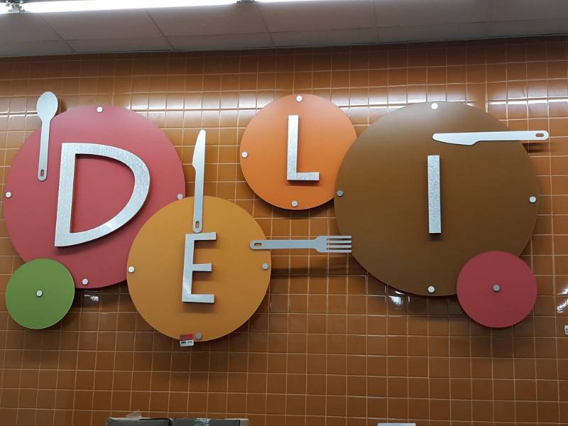 lot 2536 image: Decorative  Deli  Sign Approx 12 ft