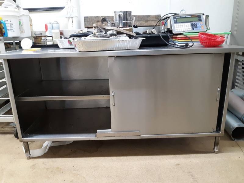 lot 2551 image: Stainless Steel Work Table with Backsplash and Sliding Door Cabinet
