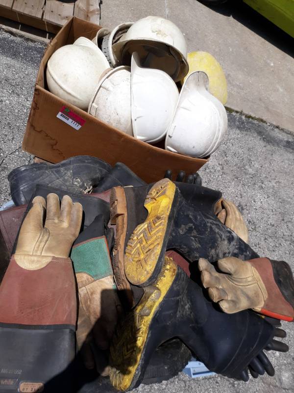 lot 1111 image: Pallet of Hard Hats, Insulated Gloves, and Boots