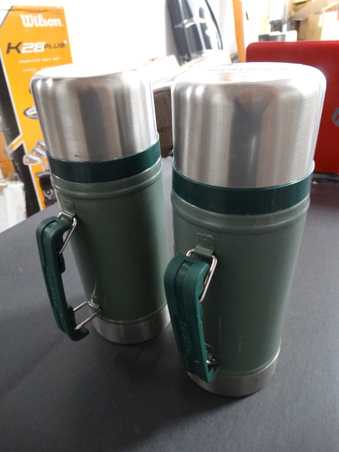 lot 227 image: 2 24oz Stanley classic vacuum bottles.