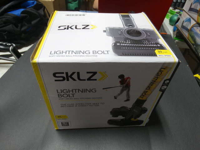 lot 277 image: SKLZ lightening bolt soft micro ball pitching machine.