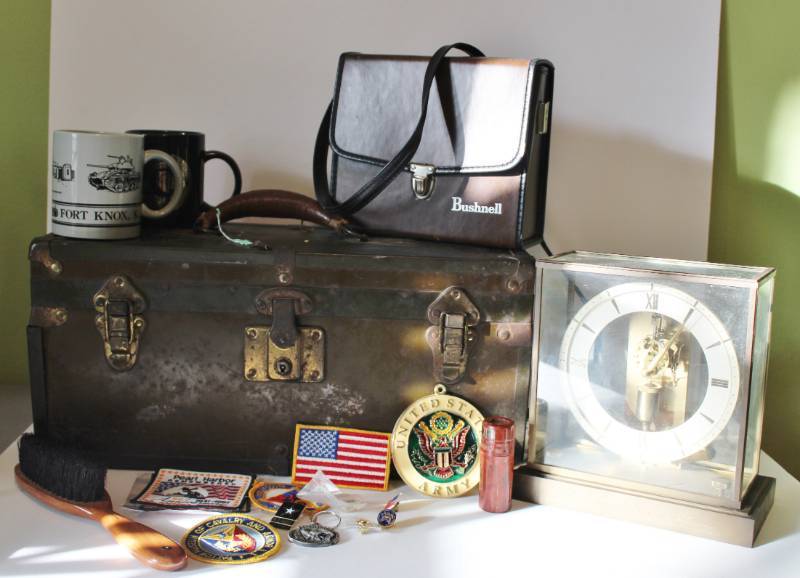 lot 1130 image: Militaria - metal box, Bushnell binoculars, clock and misc.