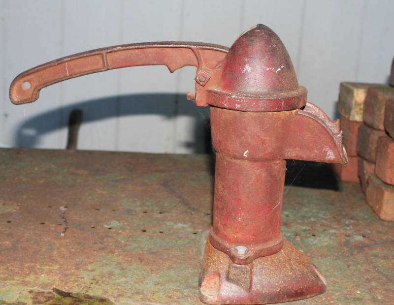 lot 1225 image: Antique water spigot and counter weight used on barn doors