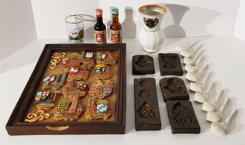 lot 1042 image: Interesting German items - 5 antique German Springerle cookie wax molds, 10 German clay pipes, German wax wall plaque, vase and glass