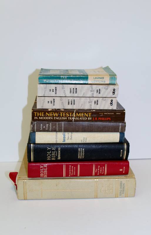 lot 1148 image: 9 book lot of Bibles and religious reference books