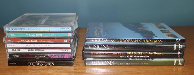 lot 1179 image: 4 Travel DVDs and 7 music CDs