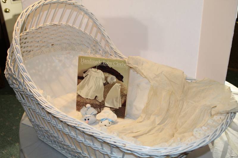 lot 1344 image: White Wicker Baby Bassinet, Antique baby christening gown