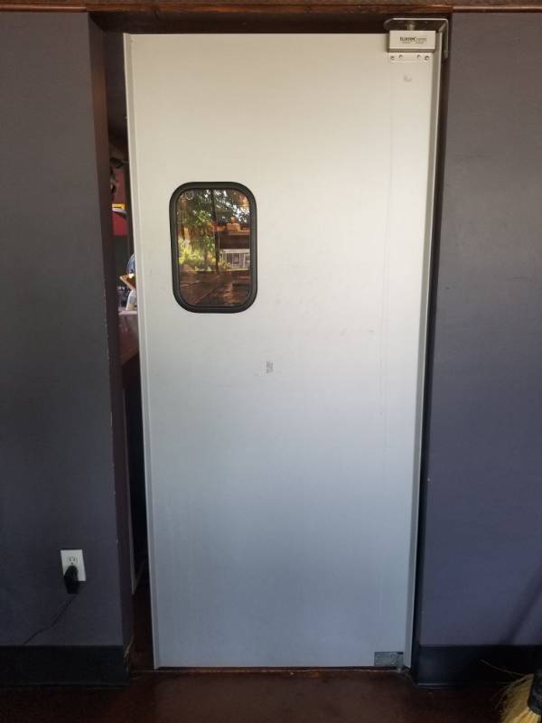 lot 1555 image: Eliason Swinging Door 35in x 80in