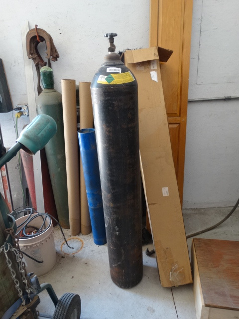lot 346 image: Nitrogen bottle, has some but amount is unknown. bottle stands 57 tall.