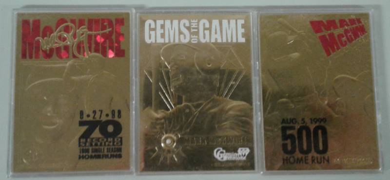 lot 1095 image: Three Mark McGwire 22KT Gold Baseball Cards including 70th Homer, 500th Homer, and Actual Gem Piece In Card