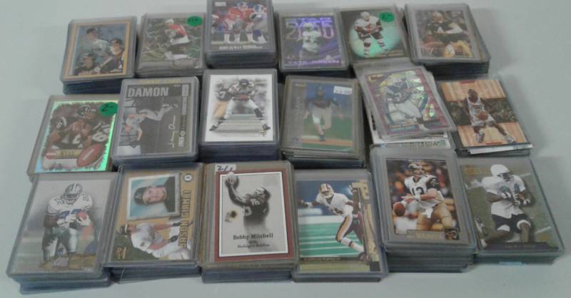 lot 1099 image: Two Row Shoebox Full of Top Loaded & Penny Sleeved Sports Cards - Mostly Football, Some Baseball, Basketball - No Commons, All Stars, Rookies, Inserts, Hall of Famers - Tons of Photos