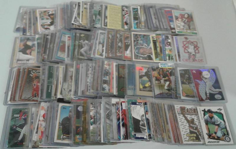 lot 1101 image: Two Row Shoebox Full of Top Loaded & Penny Sleeved Sports Cards - Football, Baseball, Basketball - No Commons, All Stars, Rookies, Inserts, Hall of Famers - Tons of Photos