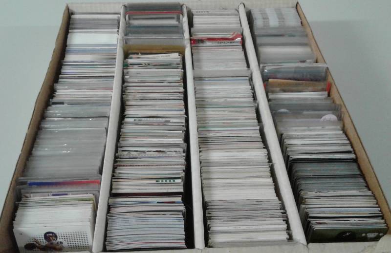 lot 1104 image: Four Row Box of Random Sports Cards Loaded With Star Cards, Rookies, All Three Major Sports - Unpicked Box of Sports Cards