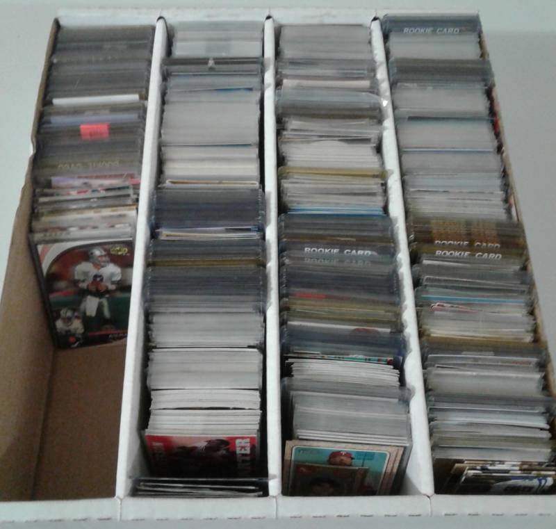 lot 1106 image: Four Row Box of Random Sports Cards Loaded With Star Cards, Rookies, All Three Major Sports - Unpicked Box of Sports Cards - Lots of Photos