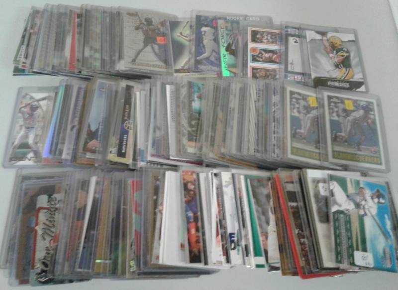lot 1107 image: Three Row Box of Random Sports Cards Loaded With Star Cards, Rookies, All Three Major Sports - Unpicked Box of Sports Cards - Lots of Photos
