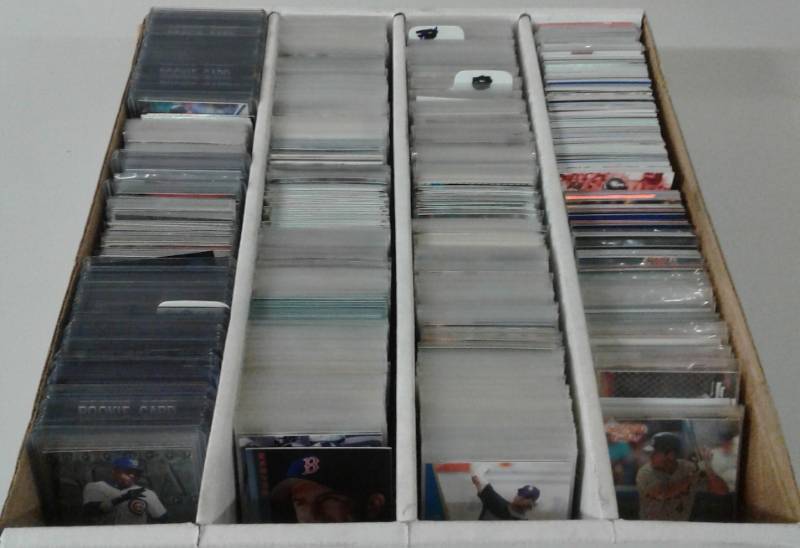 lot 1109 image: Four Row Box of Random Sports Cards Loaded With Star Cards, Rookies, All Three Major Sports - Unpicked Box of Sports Cards