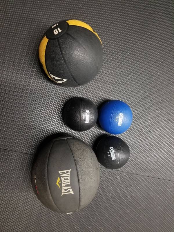 lot 1760 image: Medicine Balls 12lb, 10lb and 3 8lbs