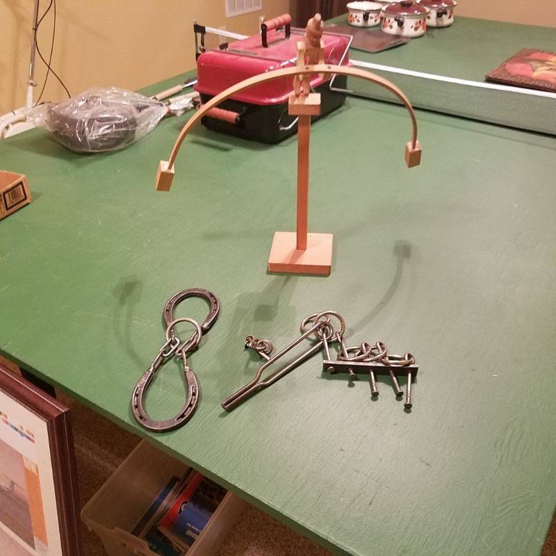 lot 6977 image: Mind challenge toys and wood balance guy