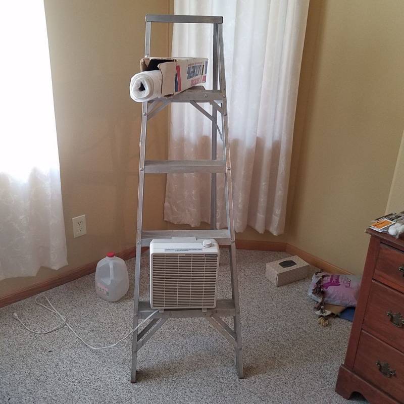 lot 6988 image: 5 foot aluminum ladder, roll of plastic sheeting, fan