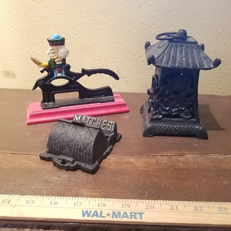 lot 7013 image: cast iron incense burner, matches holder and Nutcracker