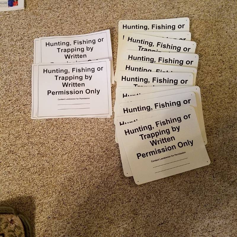 lot 7035 image: 12 paper and 12 plastic  hunting, fishing or trapping by written permission only  signs