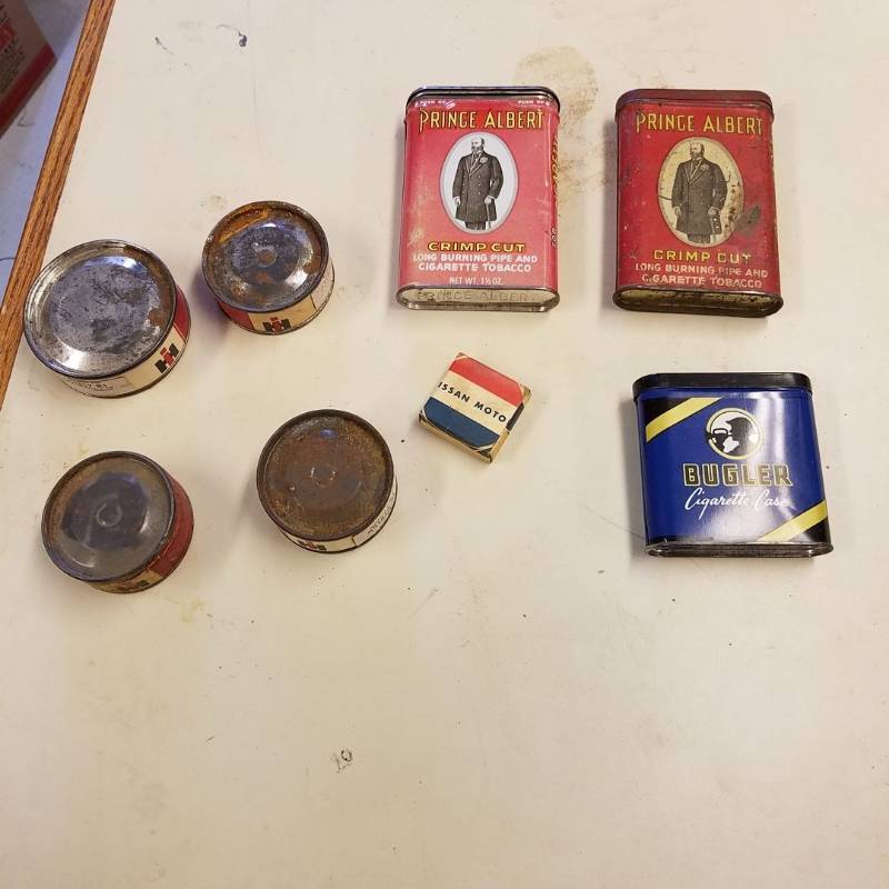 lot 7062 image: primitive items - cigarette cans and International Harvester bearings - 3 are sealed