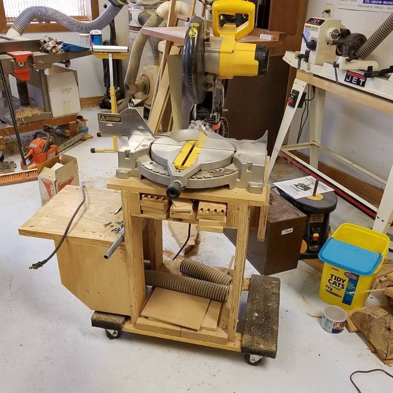 lot 7074 image: DeWalt 10in compound miter saw, on wood stand and Dolly
