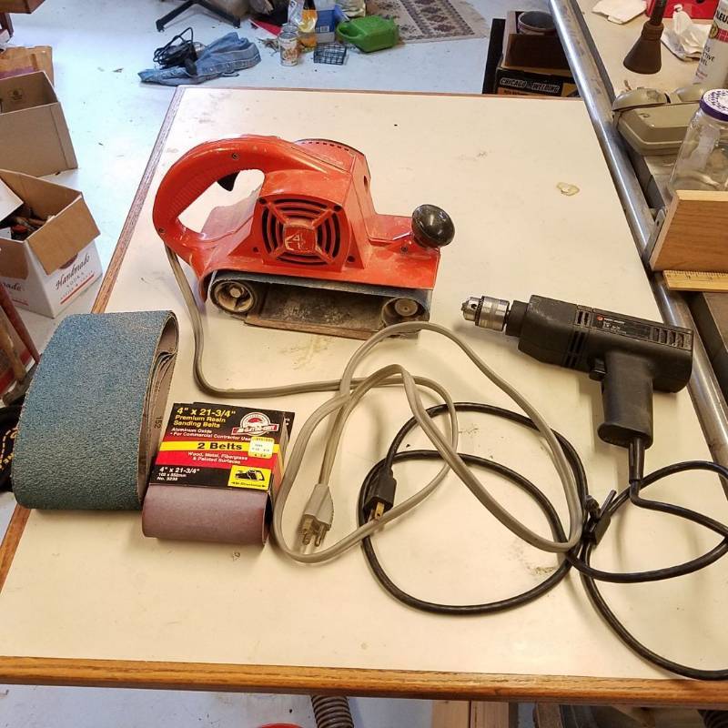 lot 7082 image: 4 inch belt sander and Black & Decker basic 38 inch drill