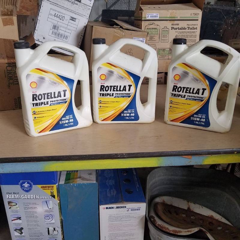lot 7205 image: Rotella T triple protection heavy duty engine oil- all three gallons appear new
