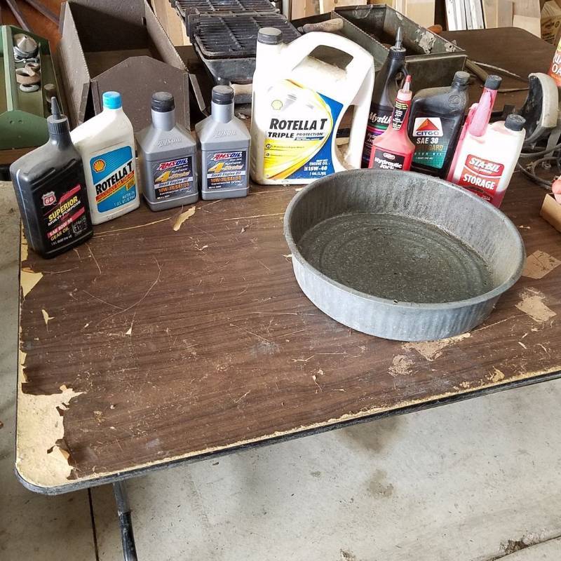 lot 7249 image: oil pan and oil- four on left are full