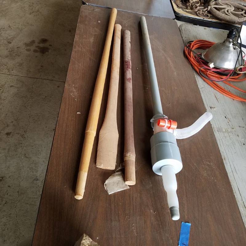 lot 7274 image: Three Wooden handles and a barrel pump