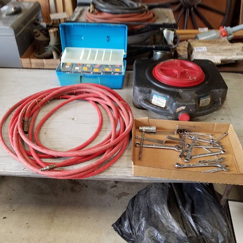 lot 7301 image: air hose, oil drain, assorted wrenches, tackle box