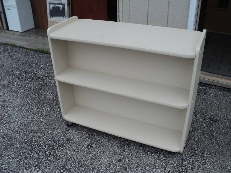 lot 8371 image: Double sided painted wooden library Cart, 15 x 37 x 30, off white caster wheels
