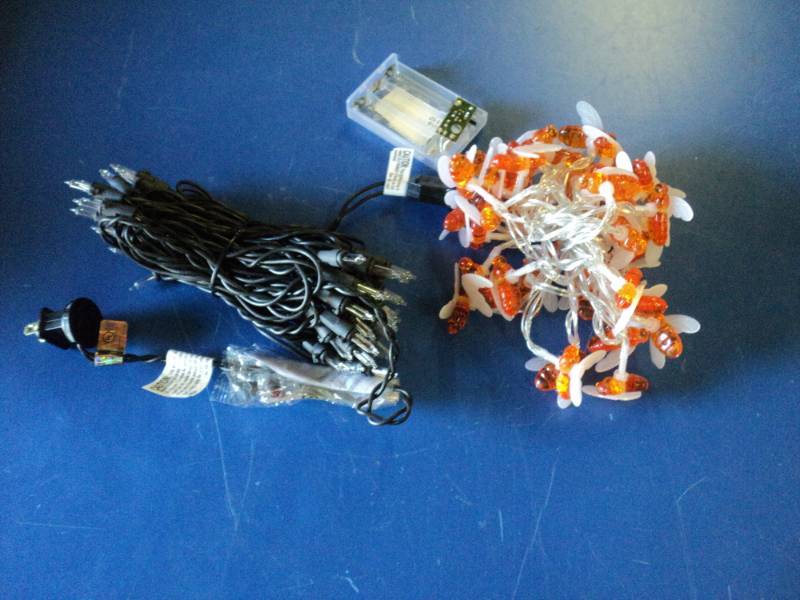 lot 9187 image: Mixed lot (1) strand bumble bee lights, battery operated, takes (3) AA batteries-not included, (1) strand christmas lights white