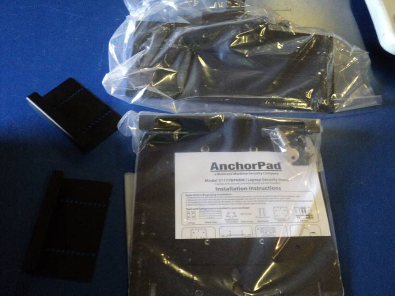 lot 9197 image: Anchorpad Model 31177BPARM Laptop Security Stand, not in original box, may be incomplete