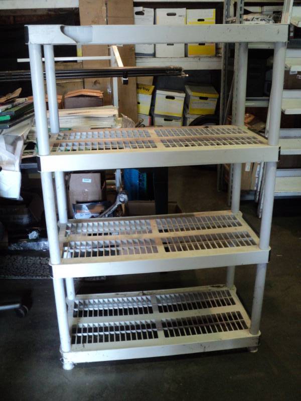 lot 9212 image: 4-tier Keter plastic storage shelf, 18 x 36 x 56 tall, used, easy to assemble disassemble, damage to top shelf- see photo